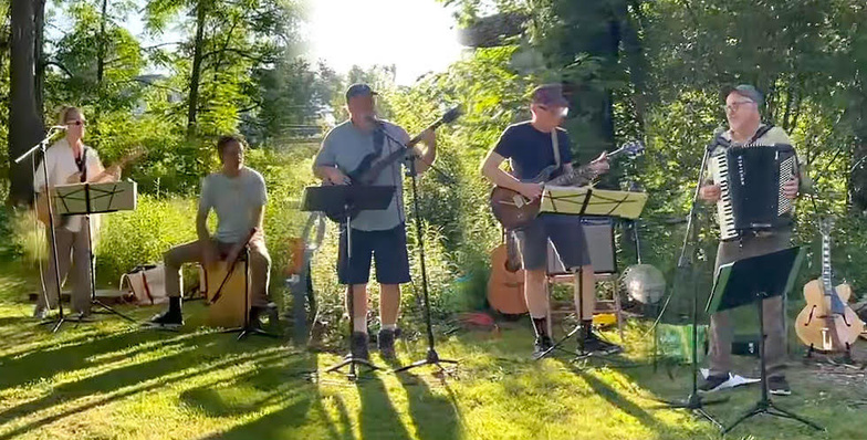 Hidden Garden Band playing an outdoor show